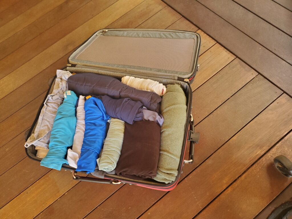 Open suitcase with clothes