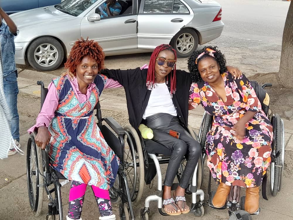 Three women in wheelchairs in Harare Zimbabwe